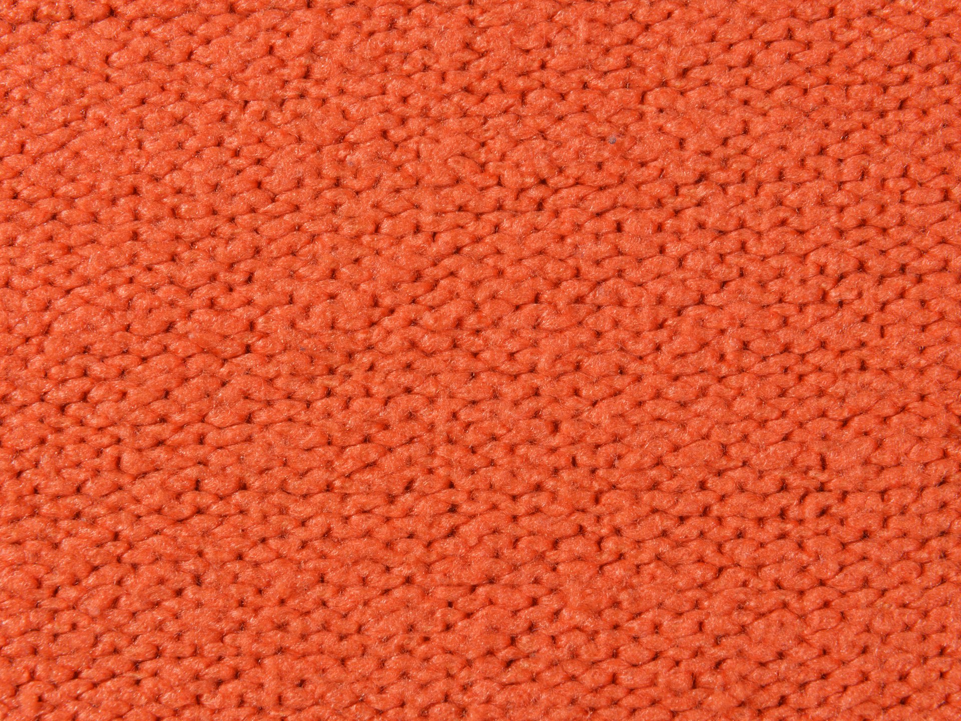 a close up of an orange carpet texture